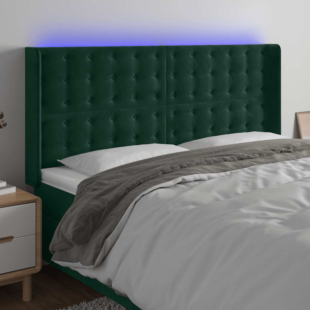 sengegavl med LED-lys 203x16x118/128 cm fløjl mørkegrøn