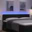 LED sengegavl med LED-lysstrimler Sort 180 cm Stof