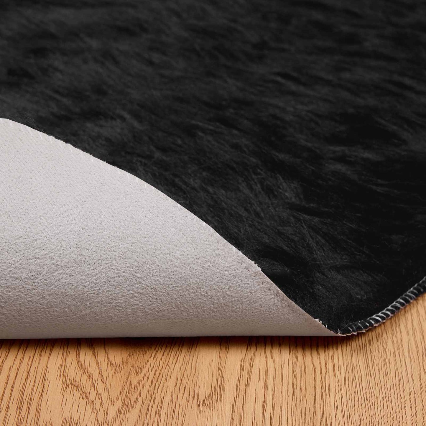 Fuskobbel lammeskindstæppe TAFALLA Sort Ø 120 cm Polyester