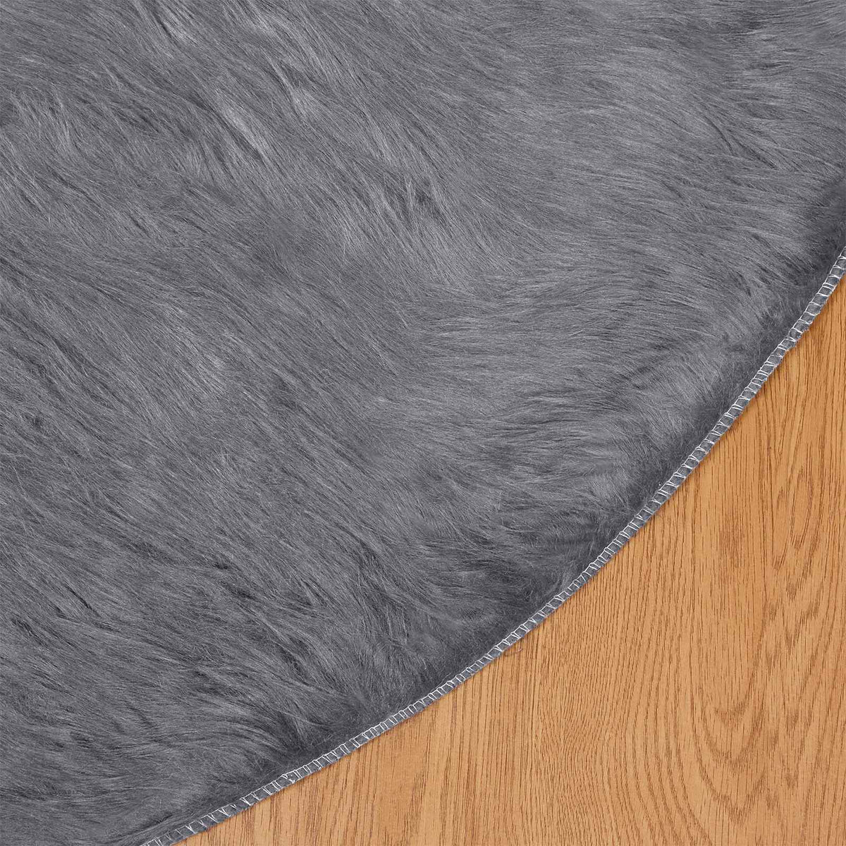 Fuskobbel lammeskindstæppe TAFALLA Antracit Ø 100 cm Polyester